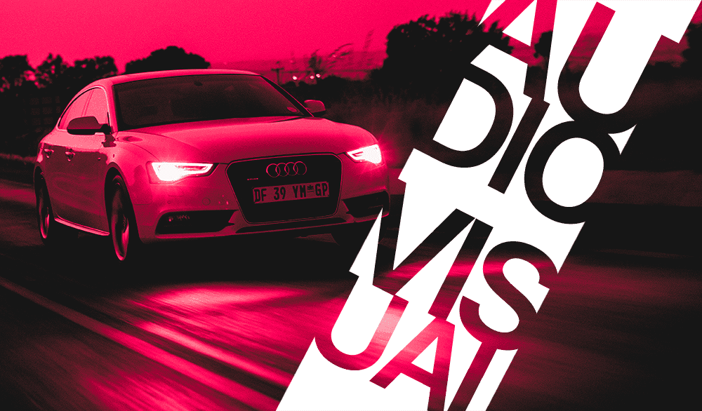 A car driving down a road with the words audio visual.
